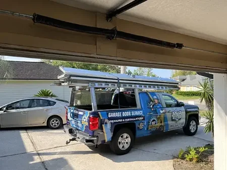 Action Garage Door service truck parked in a home’s driveway